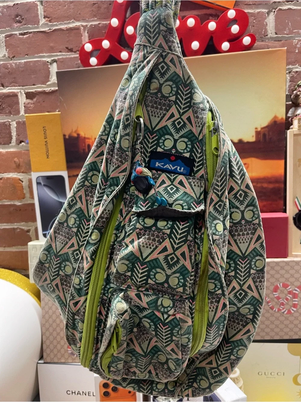 print KAVU Rope Bag featuring lime-green zippers and an owl motif accent.
